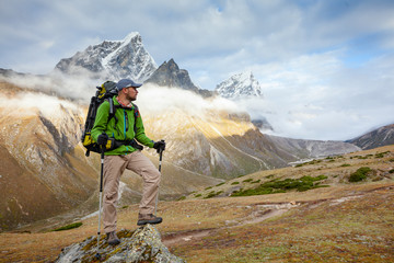 Wall Mural - hiker posing at camera on the trek in himalayas, nepal