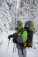 Wall Mural - Hiker walking in winter Carpathian mountains