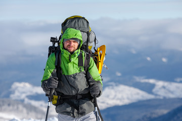 Wall Mural - Hiker walking in winter Carpathian mountains