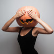 Funny pumpkin face. Dancer in Halloween costume