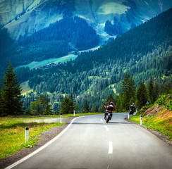 Fototapete - Group of bikers in mountains