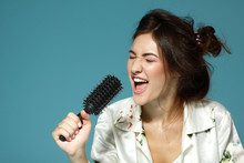 Cheerful Attractive Teen Girl Sing Song Holding Comb Like A Micr