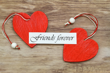 friends forever card with two red wooden hearts