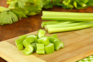 Canvas Print - Fresh green celery on table close-up