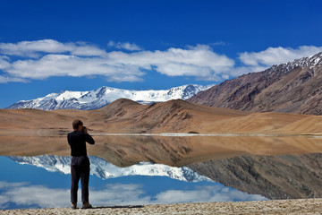 Wall Mural - Photographer at Tso Kar lake in Ladakh, India