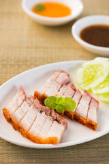 Poster - chinese roast pork close up shot served with chilli sauce