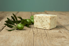 Handmade Olive Soap With Olive Branch On Wooden Table.
