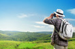Explorer watching nature through binoculars