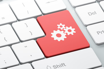 Web development concept: Gears on computer keyboard background