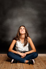 Wall Mural - pensive girl looking at chalkboard