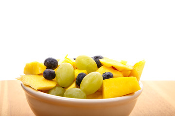 Wall Mural - Bowl of Fresh Fruit on Wood Table