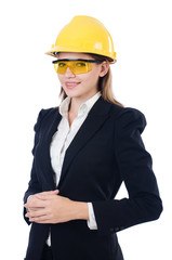 Young businesswoman with hard hat on white