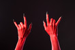 Red devil hands showing heavy metal