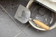 Dirty trowel and bucket on building site. Renovation at home