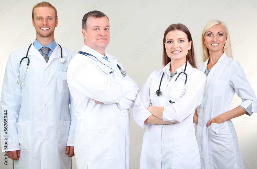 Medical workers on grey background