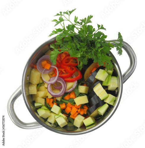 Nowoczesny obraz na płótnie Fresh cut ingredients for vegetable soup in a pot
