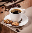 Cup of coffee and cookies on the table