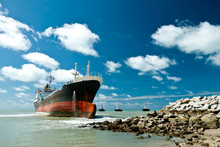 Cargo Ship Run Aground On Rocky Shore