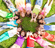 © Sergey Novikov - Many kids with lifting hands on grass