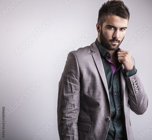 Fototapeta na wymiar Elegant young handsome man. Studio fashion portrait.