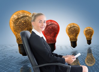 Poster - Businesswoman sitting on swivel chair with tablet