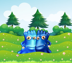 Poster - Two blue monsters at the hilltop with pine trees