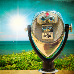 Sticker - retro style image of coin operated binoculars by ocean