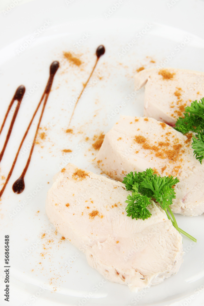 Boiled chicken meat with paprika and sauce, isolated on white