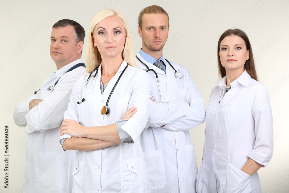 Medical workers on grey background