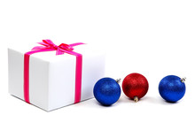 White Gift Box With Pink Ribbon And Christmas Balls Around, Isol