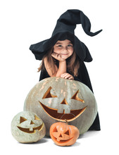 Little Witch Hiding Behind Pumpkins