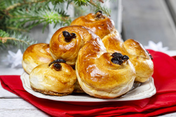 Sticker - Traditional swedish buns in christmas setting. A saffron bun