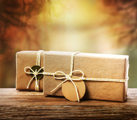 Wall Mural - Handcrafted gift boxes with an autumn background