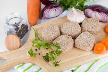 Poster - Meat patties on board on napkin  isolated on white