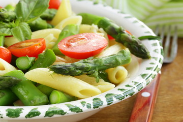 Wall Mural - penne pasta with tomatoes and asparagus, fresh spring food