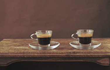 two cups of espresso on wooden table