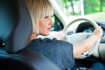 Wall Mural - attractive woman driver in her car