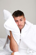 © Africa Studio - Handsome young man cant sleep in bed