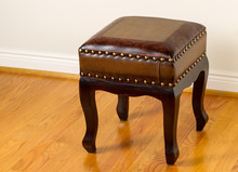 Leather Footstool On Traditional Oak Floors