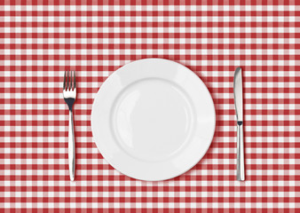 Wall Mural - Knife, white plate and fork on red picnic table cloth