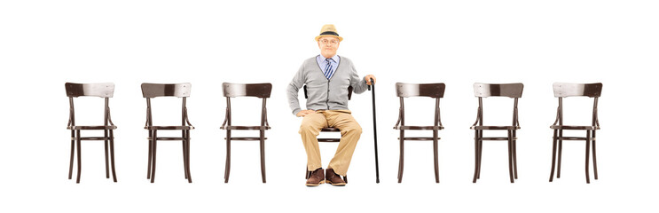 Sticker - Relaxed senior gentleman sitting on a wooden chair