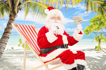 Poster - Santa claus on vacation, sitting on chair with cigar and dollars