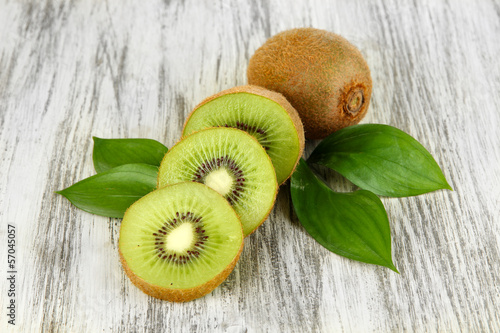 Fotografie, Tablou Ripe kiwi on wooden table close-up