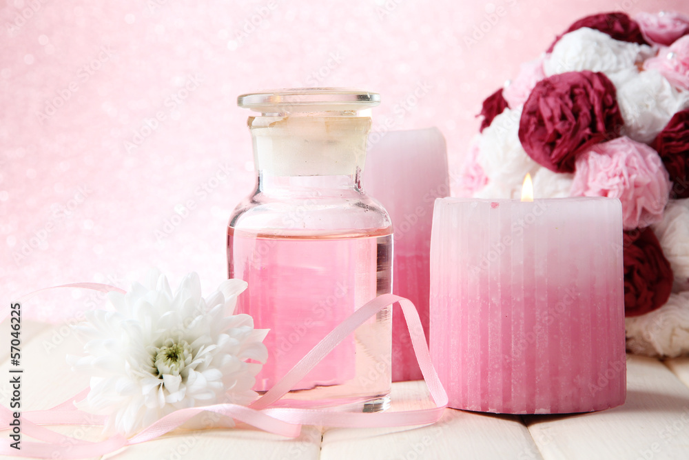 Glass bottle with color essence, on pink background