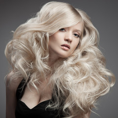 beautiful blond woman. curly long hair