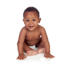 Adorable African Baby In Diaper Sitting On The Floor