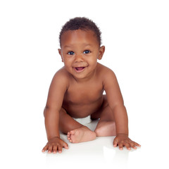adorable african baby in diaper sitting on the floor
