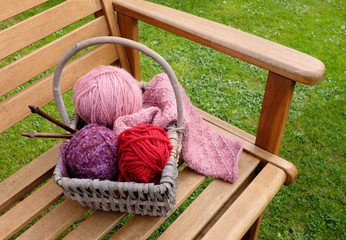 Wall Mural - Basket of knitting and yarns on a bench