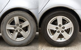 Side-by-side view of car tires before and after washing, showing the effect of cleaning on dirt removal and wheel appearance.