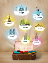 Wall Mural - Tourist suitcase with famous landmarks around the world